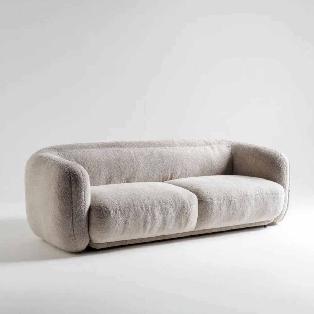Kremowa sofa dwuosobowa z tapicerką bouclé 180 × 92 × 72 cm